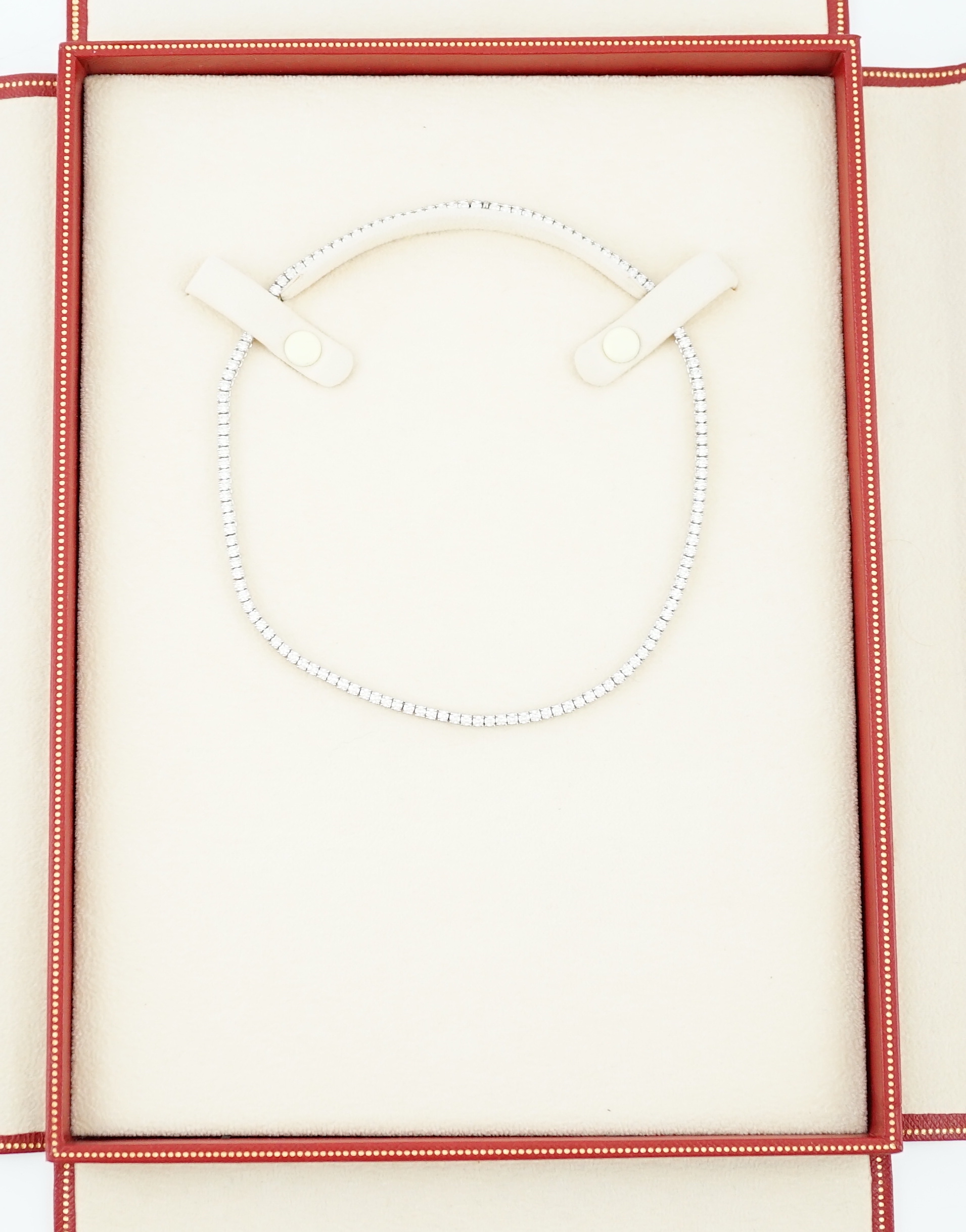 A modern Cartier 18ct white gold and diamond line choker necklace, with Cartier box and certificate dated 14/3/03